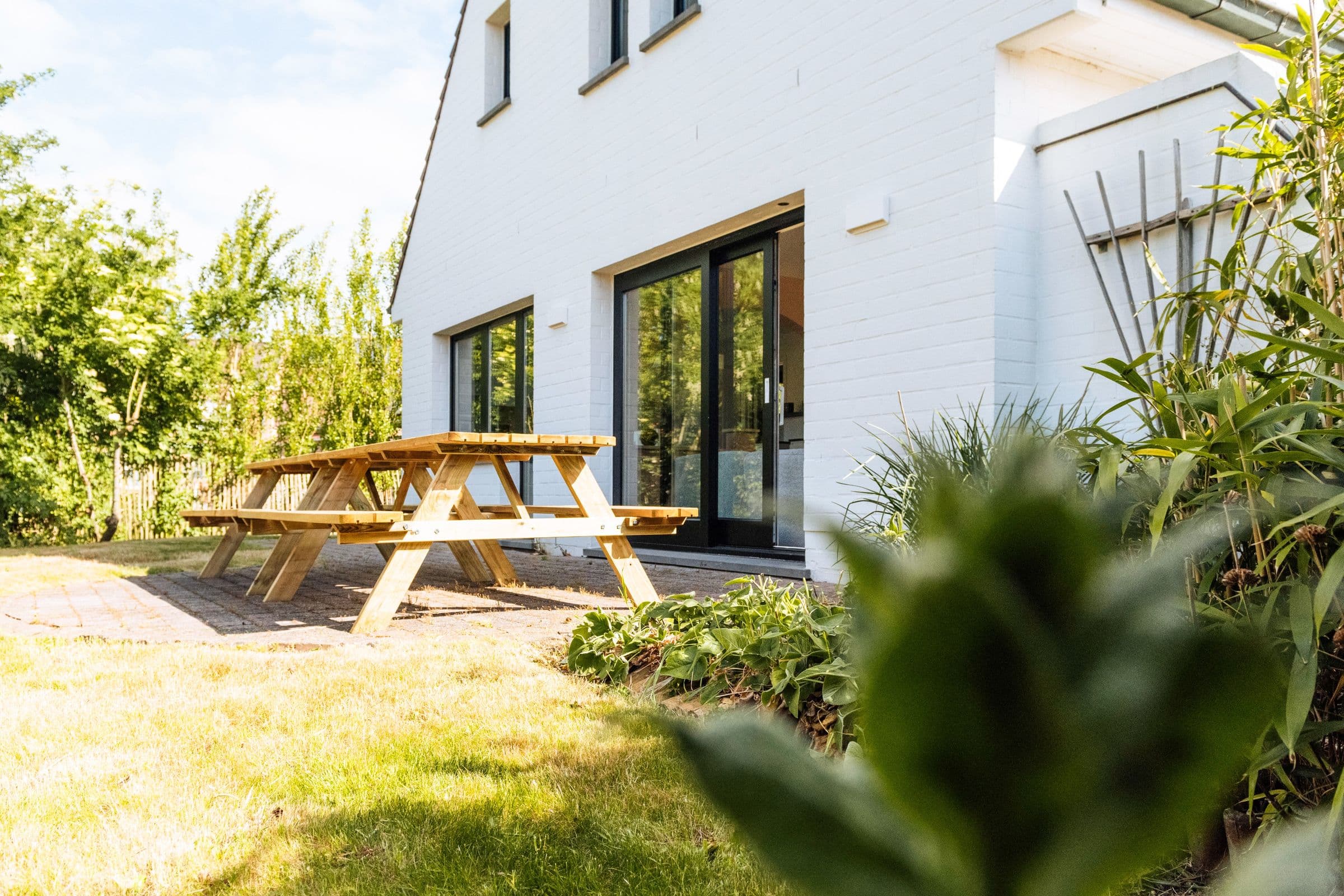 White villa with a garden and terrace