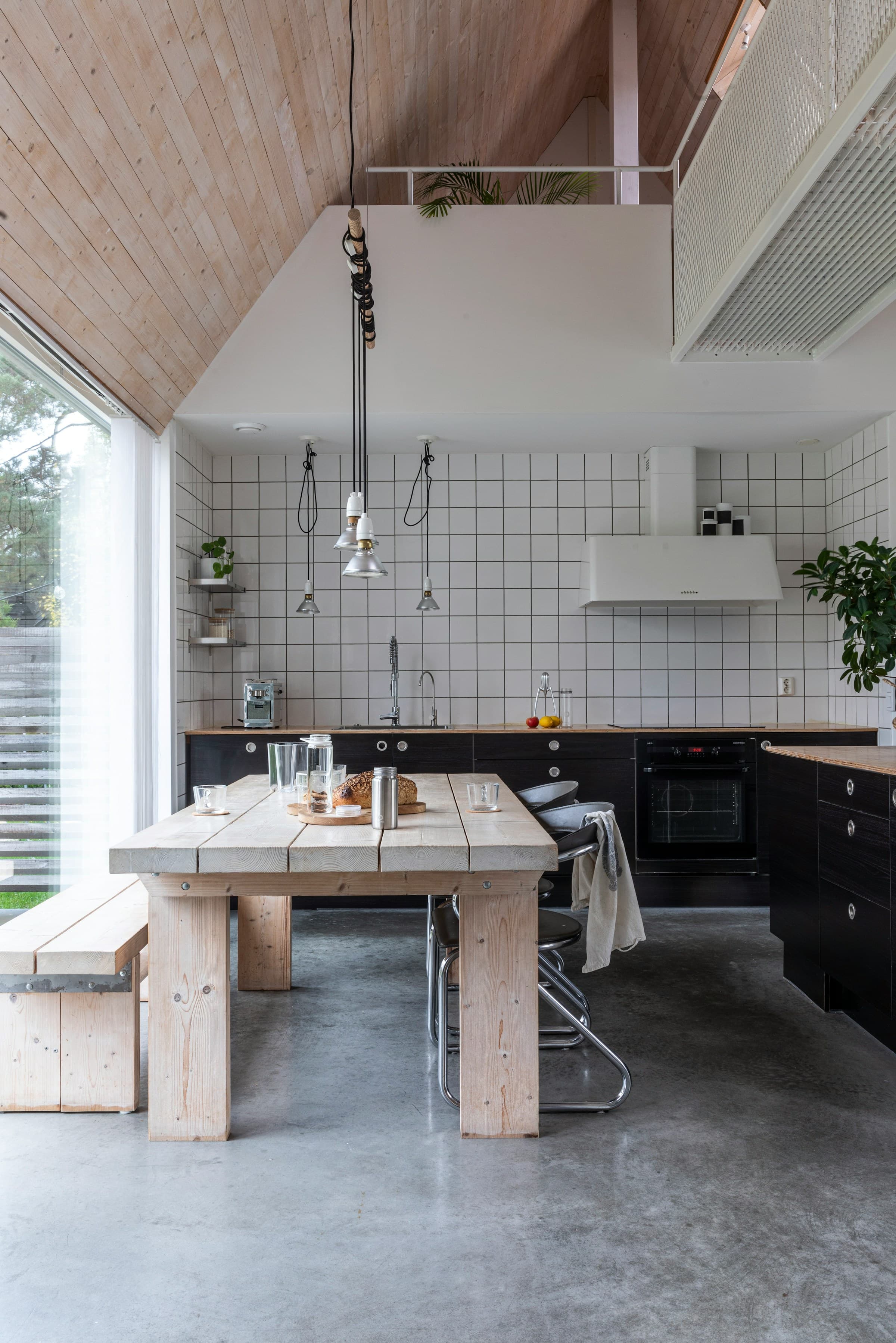 Bright kitchen with a wooden table by the window