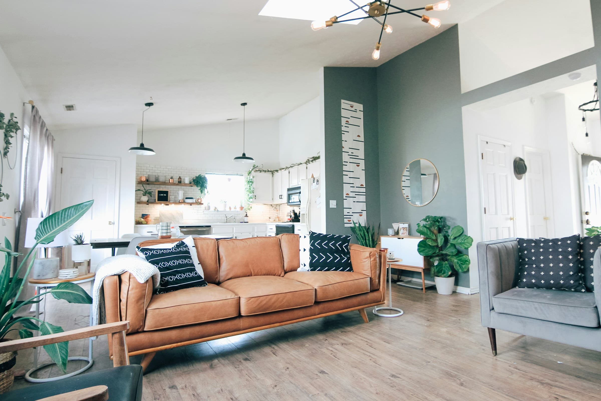 Bright living room with a sofa and open fireplace