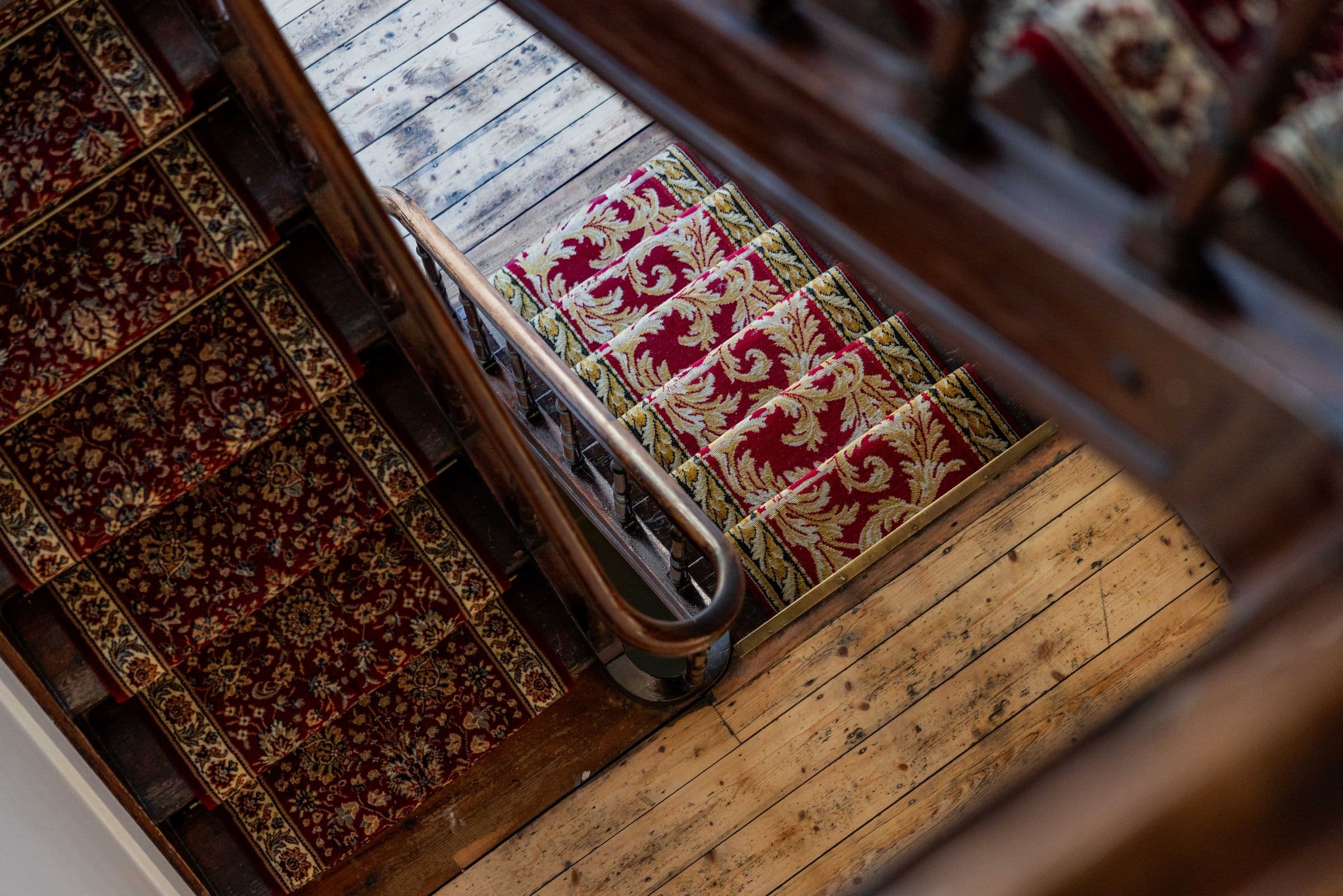 Wooden staircase with a classic runner